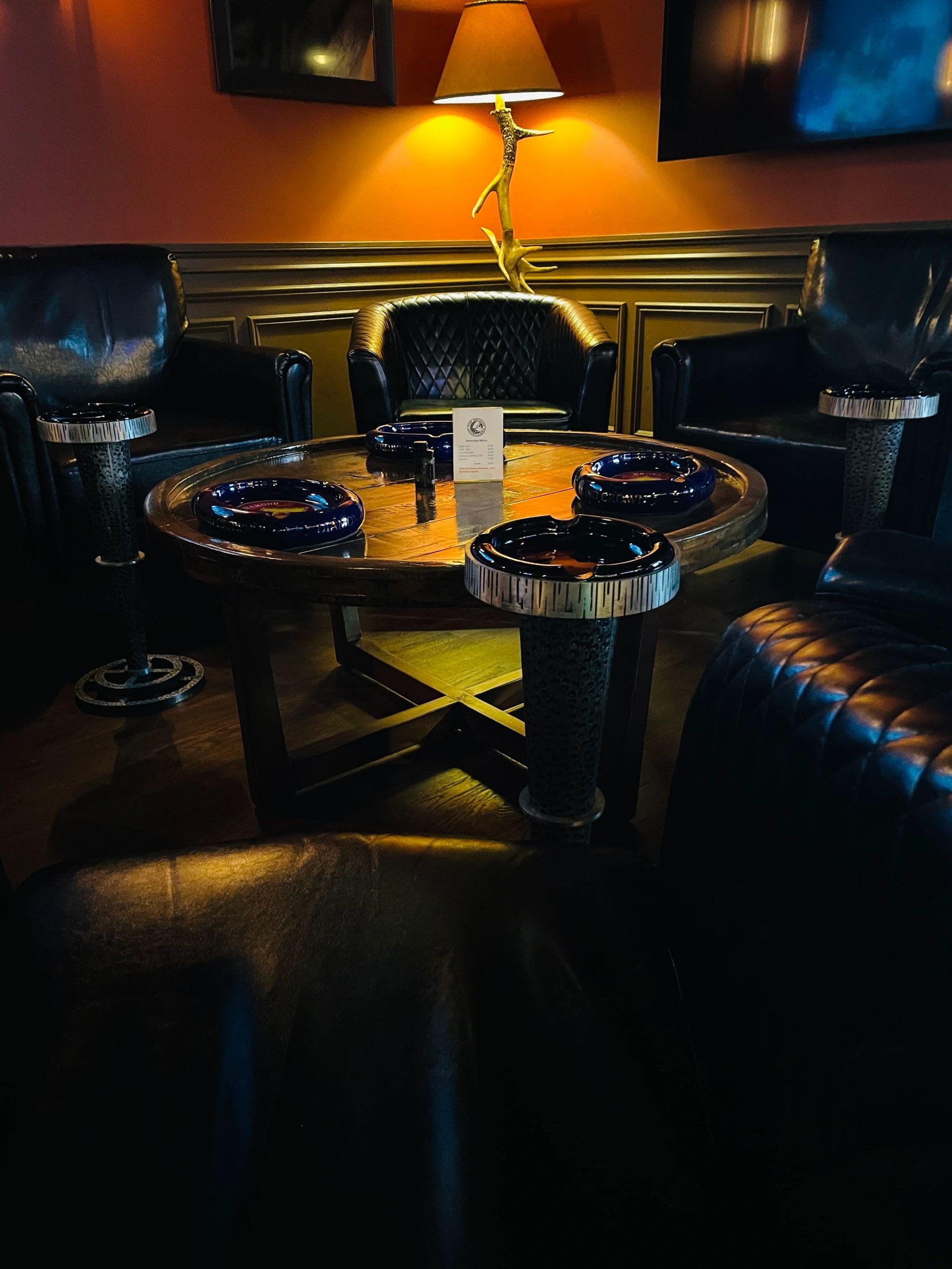 The Smokin' Gentleman Lounge interior — leather chairs and warm lighting